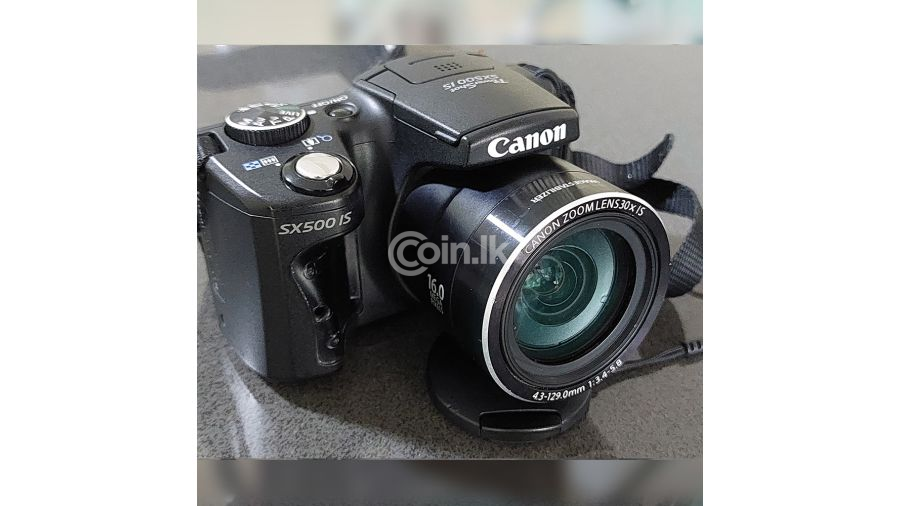 Canon PowerShot SX500 is 16 0 MP Digital Camera with 30x Wide-Angle Optical Image Stabilized Zoom and 3 0-Inch LCD